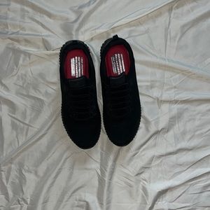 Black Sketchers Slip proof shoes